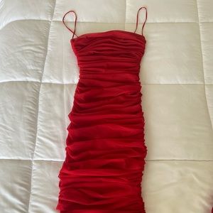 A beautiful midi length red House of CB dress